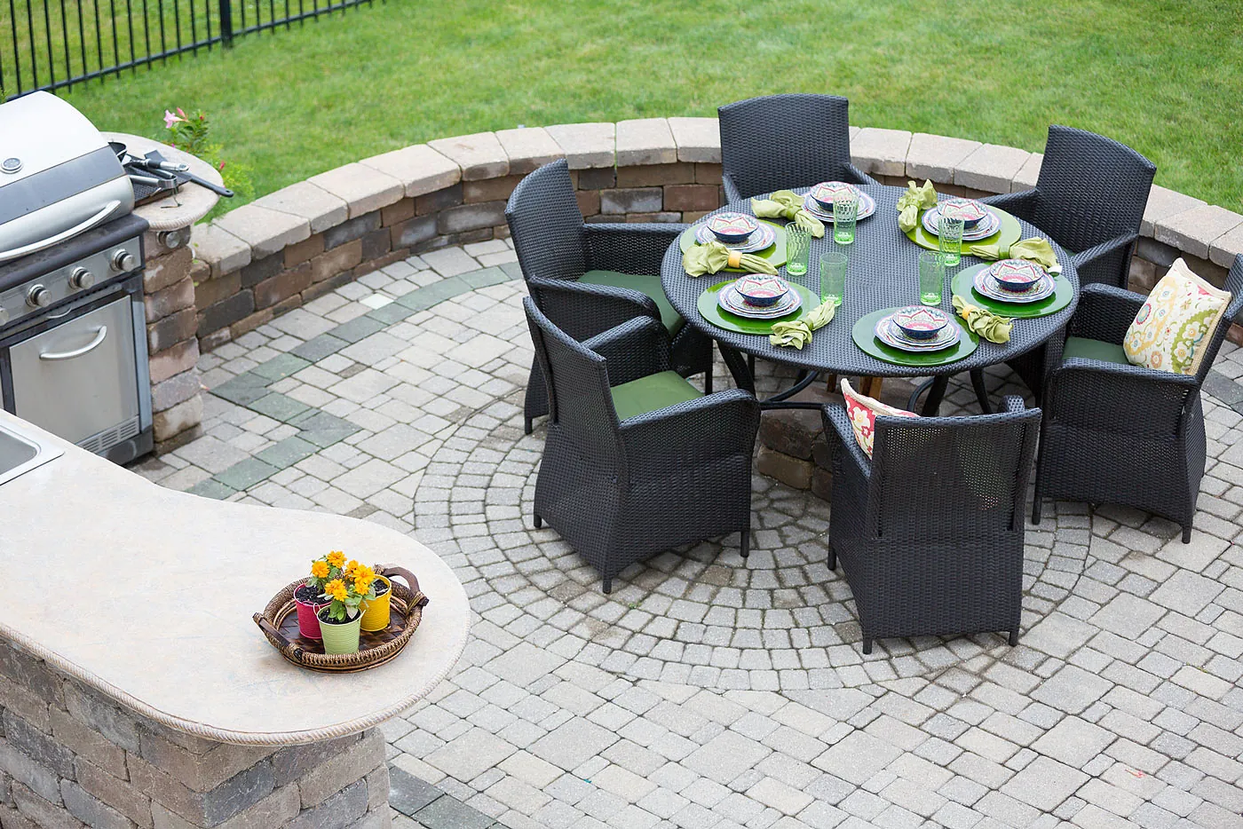 Outdoor seating and dining setup on a paved patio